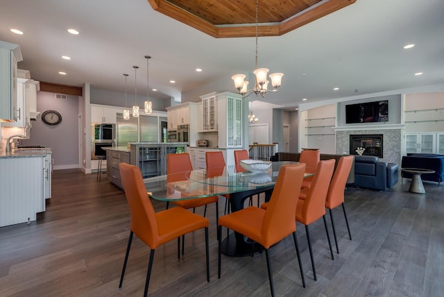 177 Wolf Hollow Rd, Lake Harmony, PA 18624 - dining area with recessed lighting, dark wood finished floors, an inviting chandelier, a raised ceiling, and wood ceiling