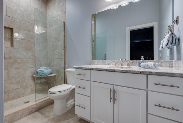 177 Wolf Hollow Rd, Lake Harmony, PA 18624 - full bathroom featuring vanity, toilet, tiled shower, and tile patterned floors