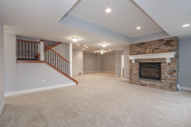 177 Wolf Hollow Rd, Lake Harmony, PA 18624 - unfurnished living room featuring a fireplace, baseboards, stairs, and carpet