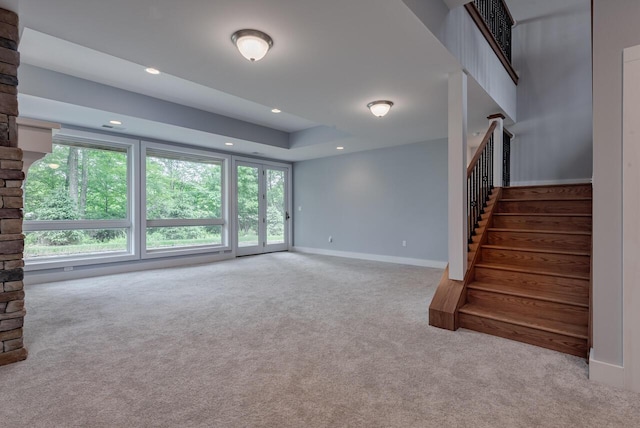 177 Wolf Hollow Rd, Lake Harmony, PA 18624 - unfurnished living room featuring baseboards, carpet flooring, recessed lighting, and stairs