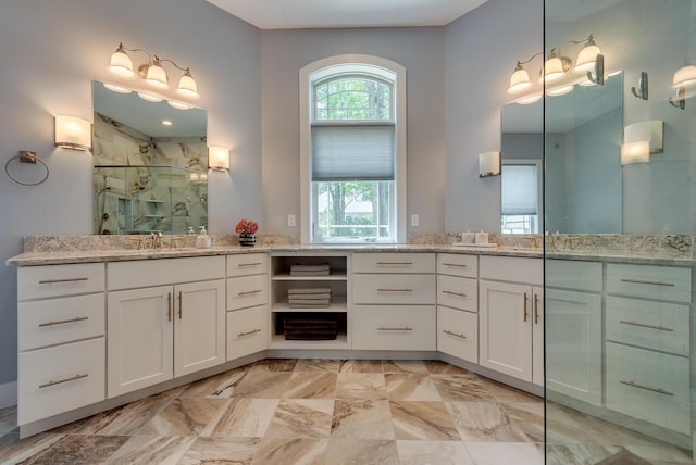 177 Wolf Hollow Rd, Lake Harmony, PA 18624 - full bath with marble finish floor, two vanities, a sink, and a marble finish shower