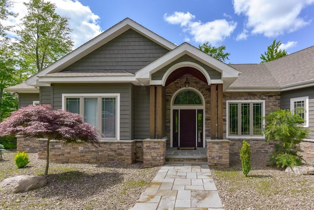 177 Wolf Hollow Rd, Lake Harmony, PA 18624 - property entrance with roof with shingles and stone siding