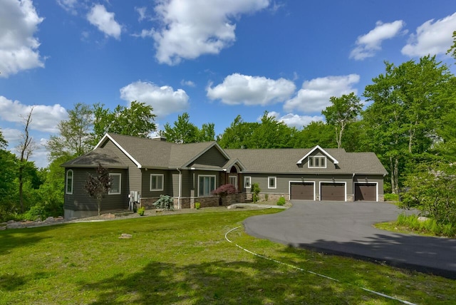 177 Wolf Hollow Rd, Lake Harmony, PA 18624 - view of front facade featuring an attached garage, aphalt driveway, stone siding, and a front yard