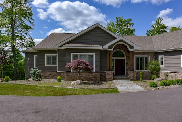 177 Wolf Hollow Rd, Lake Harmony, PA 18624 - craftsman-style home with roof with shingles and stone siding