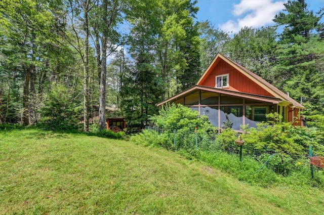 2459 Overlook Ln, Pocono Pines, PA 18350 - view of green lawn featuring a sunroom and a forest view
