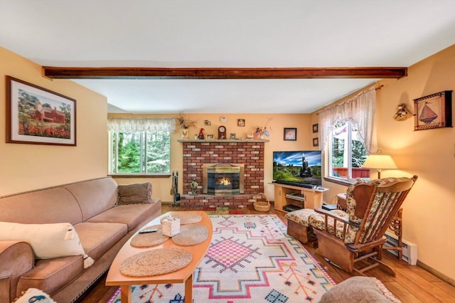 2459 Overlook Ln, Pocono Pines, PA 18350 - living room featuring beamed ceiling, wood finished floors, a brick fireplace, and a baseboard heating unit
