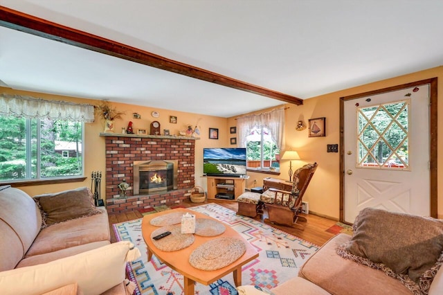 2459 Overlook Ln, Pocono Pines, PA 18350 - living room featuring wood finished floors, a brick fireplace, and beam ceiling
