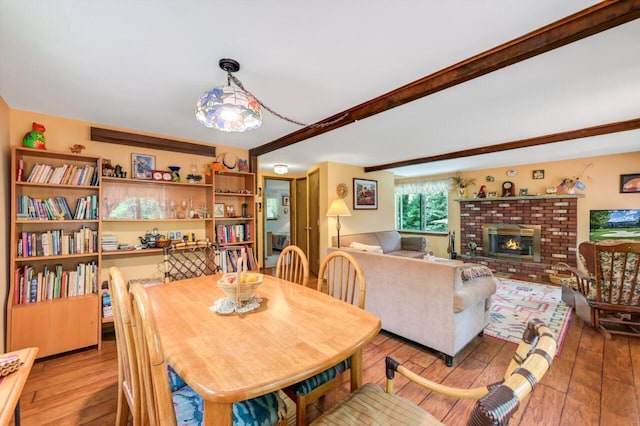 2459 Overlook Ln, Pocono Pines, PA 18350 - dining room featuring wood-type flooring and a fireplace