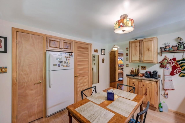 2459 Overlook Ln, Pocono Pines, PA 18350 - dining room with arched walkways and light wood-style floors