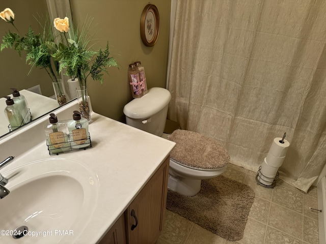 full bathroom featuring vanity, toilet, a shower with curtain, and tile patterned flooring