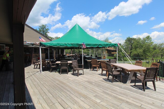 wooden terrace with outdoor dining area