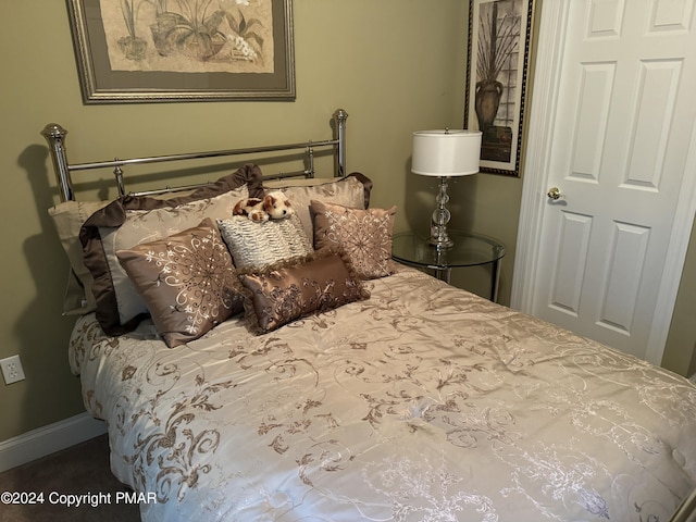 bedroom featuring baseboards