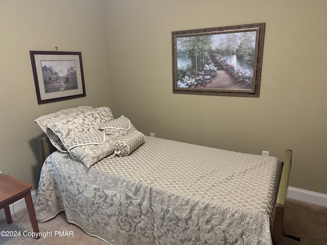 carpeted bedroom with baseboards