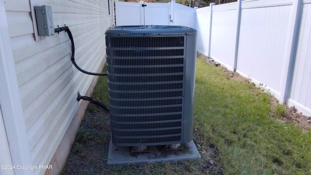 details with central air condition unit and fence