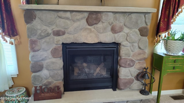 details featuring a fireplace and visible vents