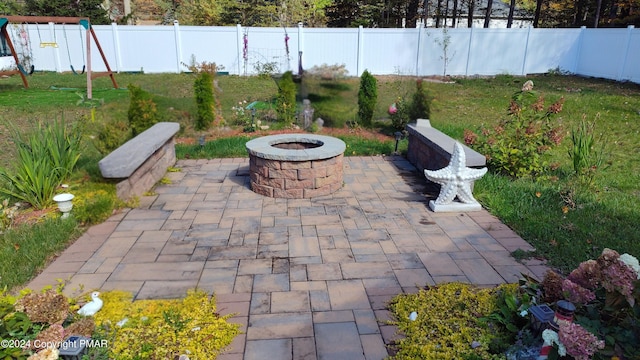 view of patio / terrace with an outdoor fire pit and a fenced backyard