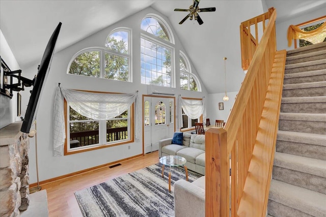 318 N Arrow Dr, Pocono Lake, PA 18347 - living room with stairway, ceiling fan, high vaulted ceiling, and wood finished floors