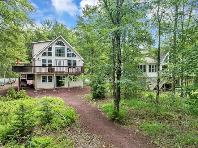 318 N Arrow Dr, Pocono Lake, PA 18347 - back of property with stairs and a wooden deck