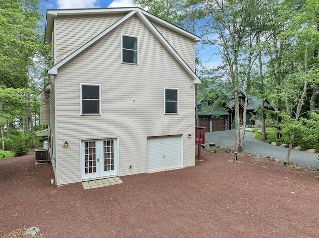 318 N Arrow Dr, Pocono Lake, PA 18347 - rear view of property featuring french doors and an attached garage