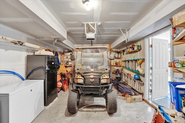318 N Arrow Dr, Pocono Lake, PA 18347 - basement featuring a garage, freestanding refrigerator, and fridge