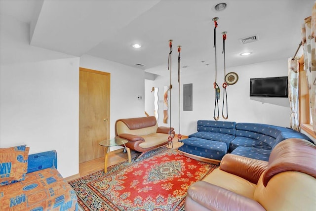 318 N Arrow Dr, Pocono Lake, PA 18347 - living room with electric panel, wood finished floors, and recessed lighting