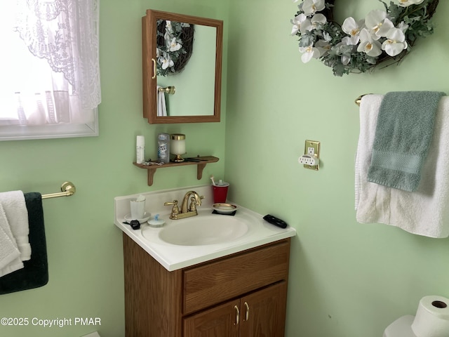 half bathroom with toilet and vanity