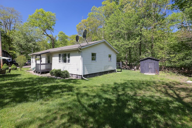 418 Leander Rd, East Stroudsburg, PA 18302 - back of house with a storage unit, a yard, and an outdoor structure