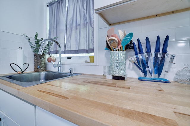418 Leander Rd, East Stroudsburg, PA 18302 - kitchen view of a sink, wooden counters, and tasteful backsplash