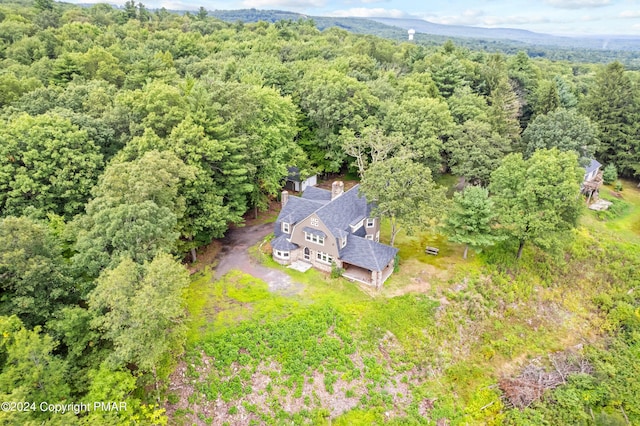 drone / aerial view with a view of trees