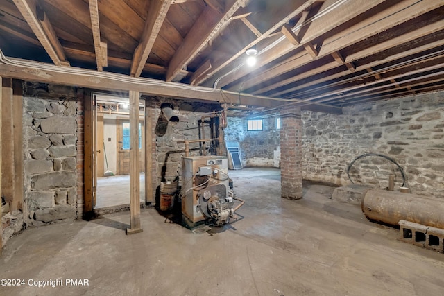 basement featuring a heating unit