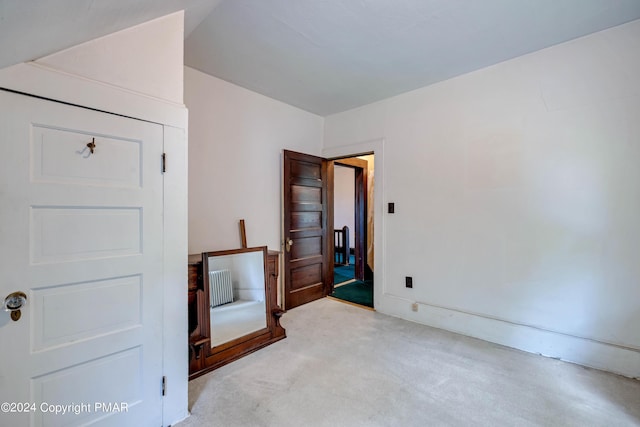 bedroom with carpet floors and radiator