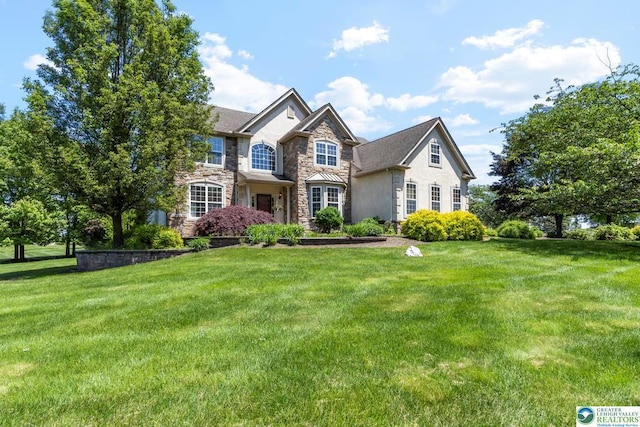 140 Birdie Way, Kunkletown, PA 18058 - view of front of house featuring stone siding, a front lawn, and stucco siding