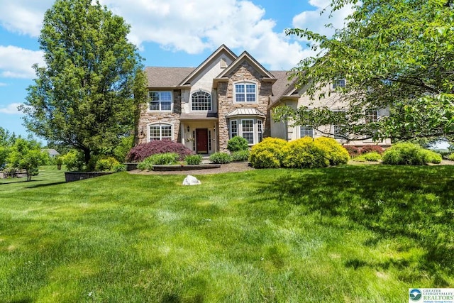 140 Birdie Way, Kunkletown, PA 18058 - view of front facade with stone siding and a front lawn