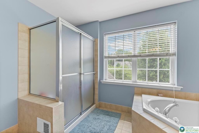 140 Birdie Way, Kunkletown, PA 18058 - full bath featuring a garden tub, a stall shower, tile patterned flooring, and baseboards