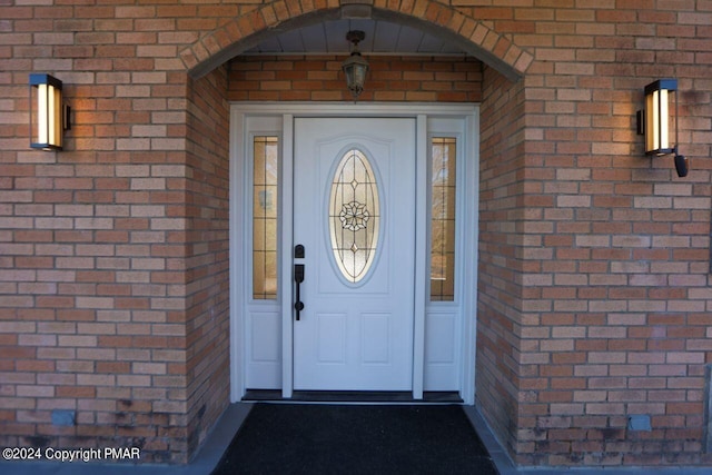 entrance to property with brick siding