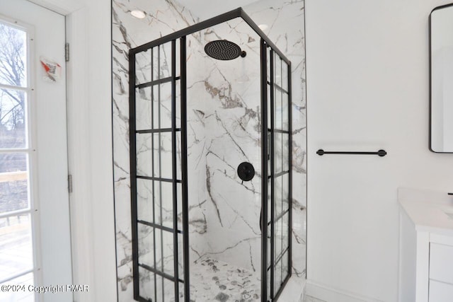 full bathroom featuring a marble finish shower