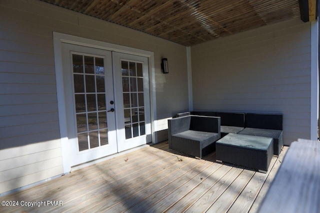 deck with an outdoor living space and french doors