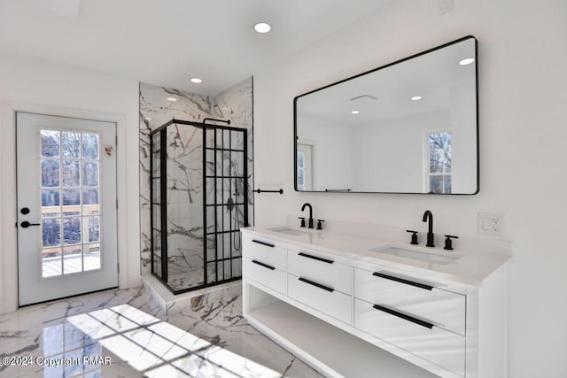 full bathroom with recessed lighting, a sink, marble finish floor, a marble finish shower, and double vanity