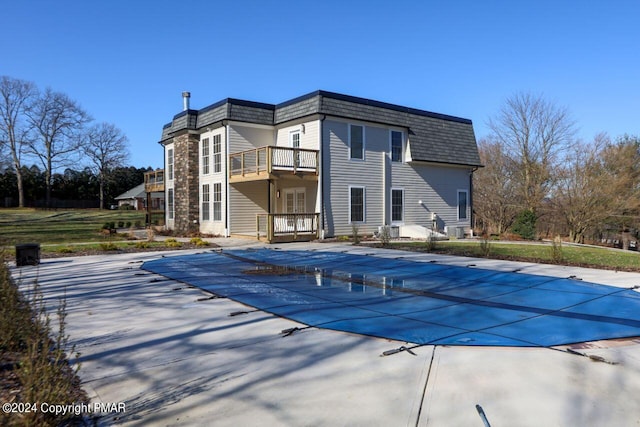 view of pool featuring a patio area and a covered pool