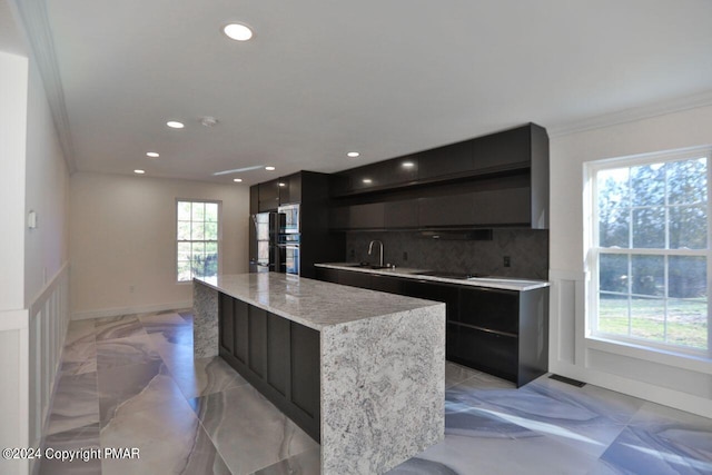 kitchen with visible vents, marble finish floor, backsplash, black appliances, and modern cabinets