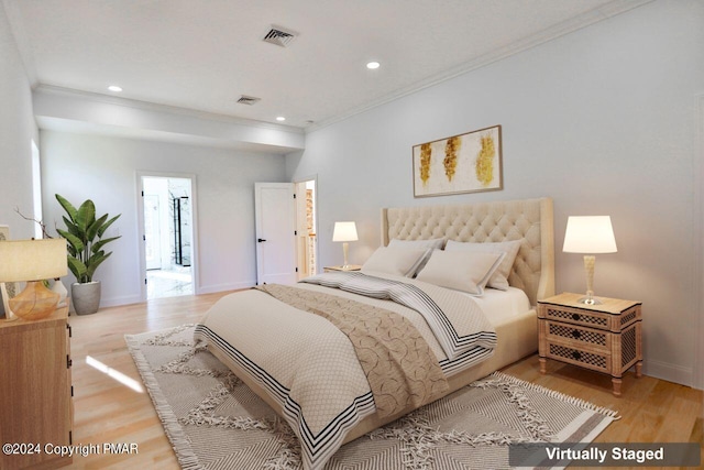 bedroom featuring ornamental molding, light wood-type flooring, recessed lighting, and baseboards