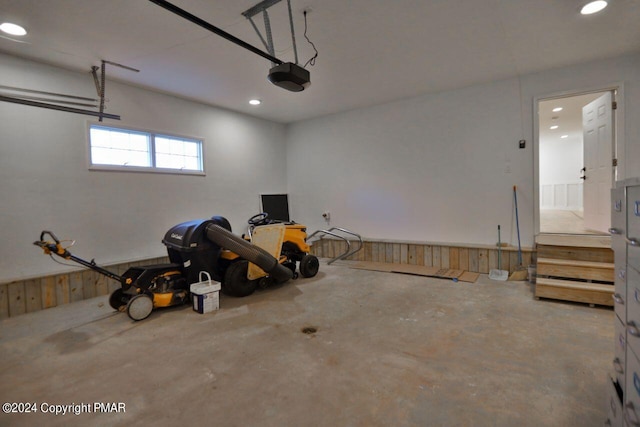 garage featuring recessed lighting and a garage door opener