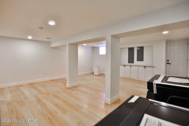 interior space with light wood-type flooring, baseboards, and recessed lighting