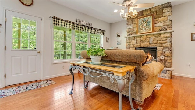 169 Roberts Rd, Starlight, PA 18461 - living area featuring healthy amount of natural light, light wood finished floors, a fireplace, and a ceiling fan