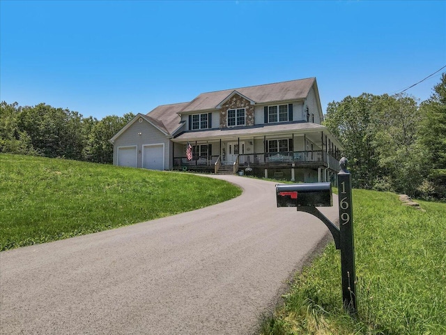 169 Roberts Rd, Starlight, PA 18461 - view of front of home with covered porch, an attached garage, and a front yard