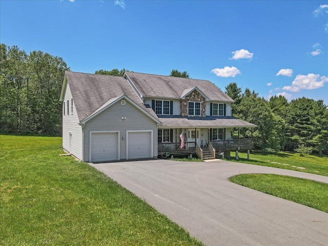 169 Roberts Rd, Starlight, PA 18461 - view of front of property featuring a porch, an attached garage, a front yard, and driveway