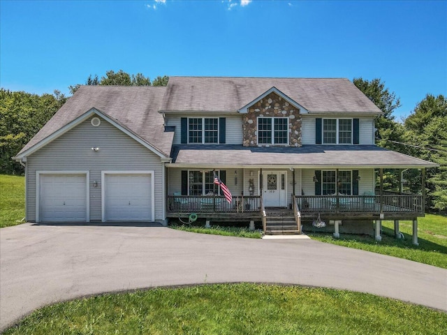 169 Roberts Rd, Starlight, PA 18461 - view of front of home with covered porch, asphalt driveway, and an attached garage