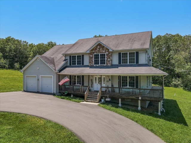 169 Roberts Rd, Starlight, PA 18461 - view of front facade with a porch, an attached garage, a front yard, and driveway