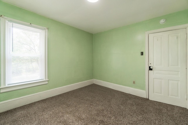 266 Laurel Rd, Lehighton, PA 18235 - empty room featuring dark carpet, plenty of natural light, and a smoke detector