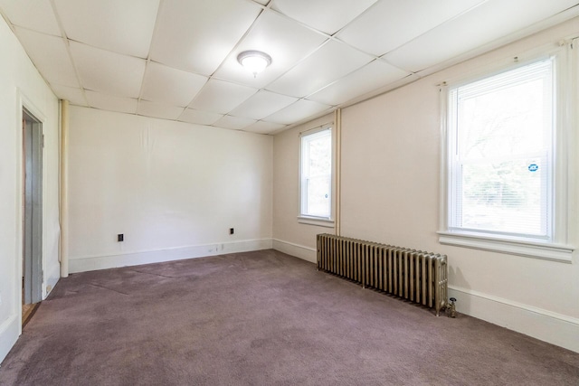 266 Laurel Rd, Lehighton, PA 18235 - carpeted empty room featuring radiator heating unit, healthy amount of natural light, and a drop ceiling